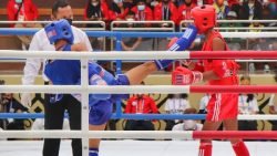 Sepakan Atlet Muay Thai Sumbar, Gilang Dwi Fajri (Biru) Tepat Mengenai Wajah Atlet Kalimantan Timur Siprianus Gobang (Merah) Pada Pon Xx Papua 2021 Di Gor Stt Gidi, Kab Jayapura